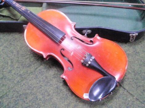 A 20thC violin, bears a Chinese label, with bow and fitted case