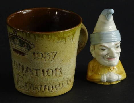 A studio style Edward VIII coronation mug, 8cm high, dated May 12th 1937, signed beneath and a Royal Worcester Mister Punch candle snuffer (2).