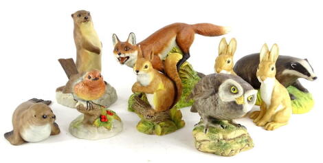 A collection of Aynsley ceramic animals, modelled by John Aynsley to include a robin, otter, badger, fox, owl, squirrel, seal and two rabbits.