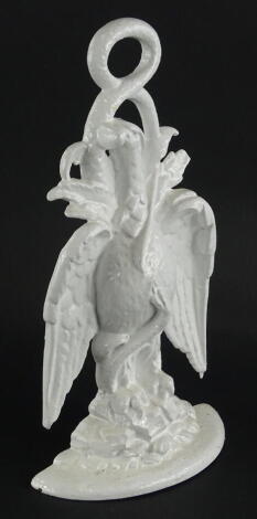 A Victorian cast iron doorstop, modelled in the form of a griffin, lozenge shaped registration marks to reverse, 36cm high.