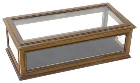 An Edwardian mahogany table top display cabinet, with glazed sides and hinged lid, stamped Lock, 56cm x 28cm.