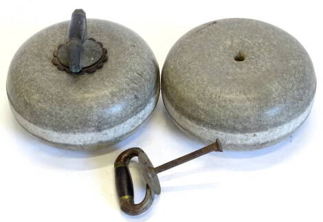 A pair of Scottish granite curling stones, each with silvered metal mounts and wooden handle, 26cm diameter.