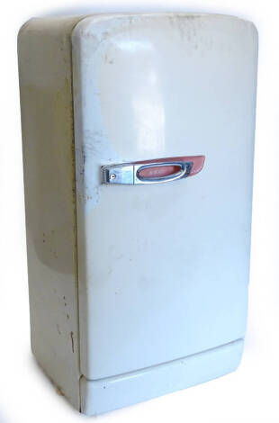 A GEC 1950s cream coloured fridge, with freezer compartment, compartments for cheese, butter, and salad, etc., 129cm high, 64cm W, (AF).