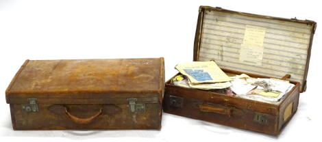 Two vintage leather suitcases, to include one with label for the Henderson Line, in Rangoon, etc., (AF).