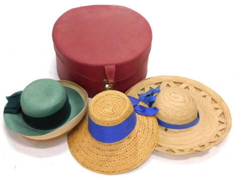 Various ladies hats, to include straw hats, mid 20thC red leather hat box, etc., (a quantity).