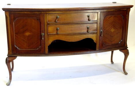 An early 20thC mahogany bow fronted sideboard, the top with a moulded edge above two frieze drawers and a recess flanked by two panel doors on cabriole legs with pad feet, previously with brass rail, 153cm high, 75.5cm wide.