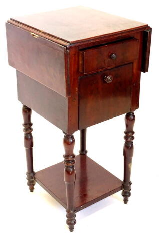 A 19thC mahogany work table, the rectangular drop leaf top with a channeled edge, above a frieze drawer and a hinged fall front door, on turned legs with undertier, 77cm high, 38cm deep, 70cm wide.