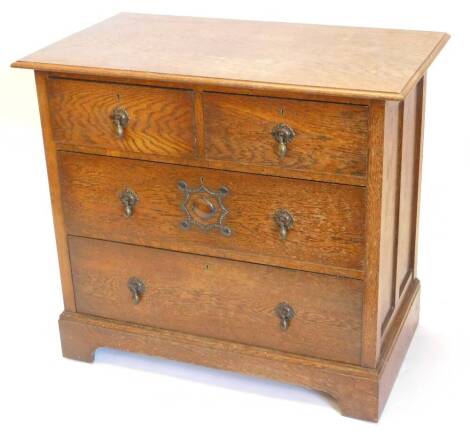 A 1920s oak chest of drawers, the top with moulded edge with two short and three long drawers, each with brass tier drop handle on bracket feet, 81cm high, 91cm wide, 59cm deep.