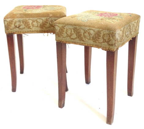 A pair of 19thC mahogany stools, each with a padded wool work seat on splayed legs, 33cm wide.