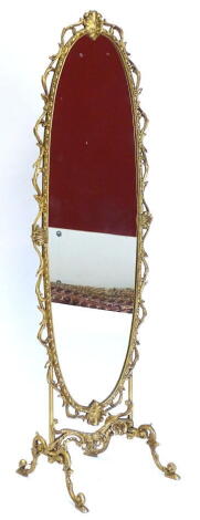 A gilt metal cheval mirror, the oval frame decorated with shells, scrolls, etc., on shaped supports, 140cm high, 45cm wide.