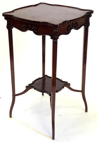 An Edwardian mahogany occasional table, the square top with a raised gallery and shaped border on splayed legs with undertier, 38cm wide.