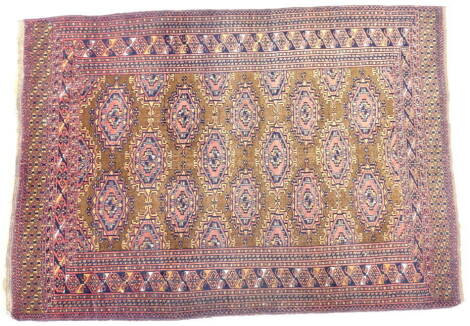 An Afghan rug, with a design of pink medallions, on a brown ground with multiple borders, 165cm x 117cm.