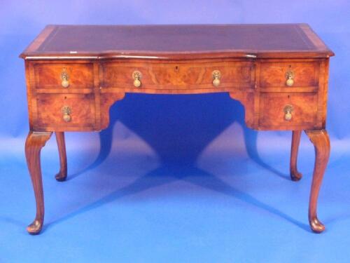 A Queen Anne style walnut writing or dressing table with leather inset