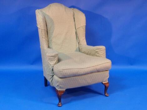 A Georgian style wing back armchair