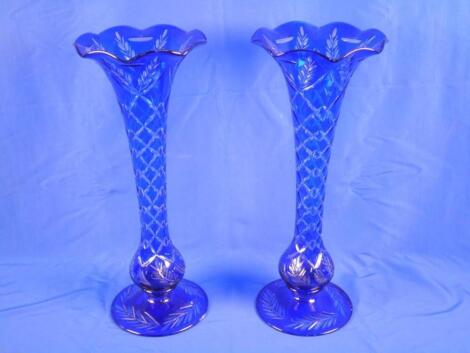 A pair of Bohemian type blue overlay glass vases