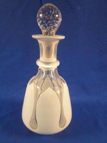 A late 19thC Bohemian white and overlay glass spirit decanter and stopper