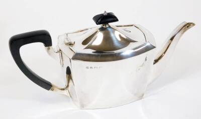 A George V silver four piece tea service, of plain form, comprising teapot, water jug 20cm high, milk jug and two handled sugar bowl Birmingham 1934, 61oz all in. (4) - 2