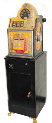 A ROL-A-TOP W one armed bandit, with £15 jackpot feature, with side handle, on a plinth base terminating in hairy paw feet with key, 155cm high, 46cm wide, 36cm deep.