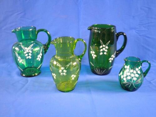 Four Victorian green glass jugs