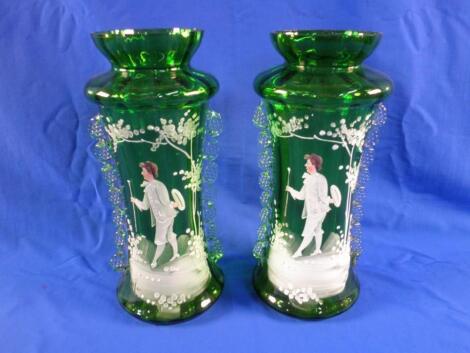 Two late Victorian Mary Gregory type green glass vases of waisted form