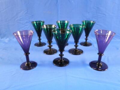 A set of six green tinted wine glasses