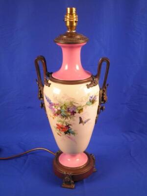 A Victorian pink and cream opaque glass table lamp