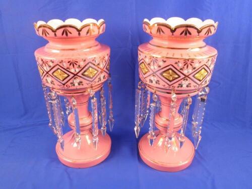 A pair of Victorian pink opaque glass table lustres