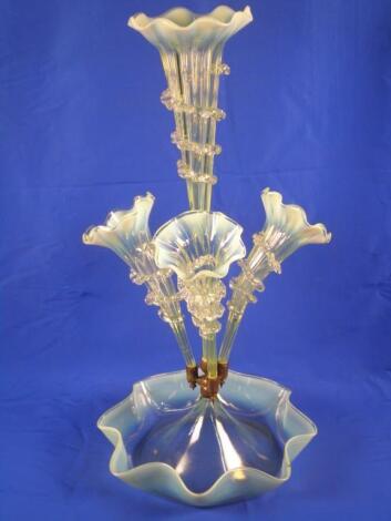 A Victorian vaseline glass epergne with a central trumpet surrounded