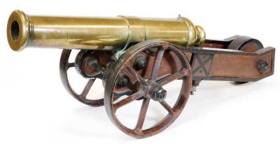 A Mid 19thC brass signal cannon, with cylindrical barrel on a shaped truckle base, inscribed PEACE 1856 TRUST IN PROVIDENCE AND KEEP YOUR POWDER DRY with two large spoked front wheels and central back wheel, with X design, 37cm high, 75cm wide, 39cm deep. - 2