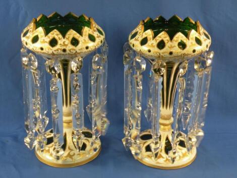 A pair of 19thC Bohemian green and white glass overlay cut table lustres