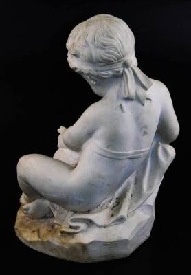 A 19thC marble figure of a seated putti, holding quill and book, wearing headband, on a rock work base, unsigned, 48cm high. - 3