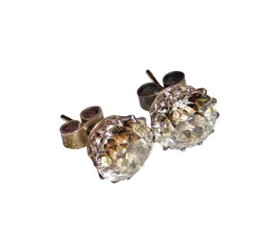 A pair of diamond ear studs, the pair comprising 7.29cts overall, one stone 10.1 x 9.9mm, the other 10.1 x 9.7mm, old European cut, set in white metal basket frames, unmarked, 4.9g all in. With Anchorcert certificate colour M-N, Clarity VS-Si. - 2