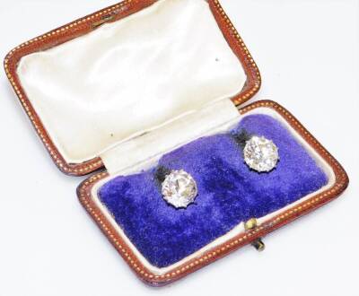 A pair of diamond ear studs, the pair comprising 7.29cts overall, one stone 10.1 x 9.9mm, the other 10.1 x 9.7mm, old European cut, set in white metal basket frames, unmarked, 4.9g all in. With Anchorcert certificate colour M-N, Clarity VS-Si. - 3