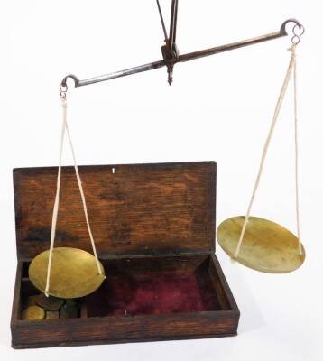 An early 19thC oak cased set of brass apothecary or gold weights and pan balance, and a further modern set. (2) - 4