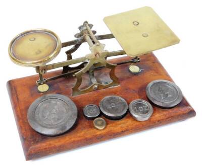 A set of Victorian brass and mahogany postal scales with weights, and a further oak block of weights. (2) - 2