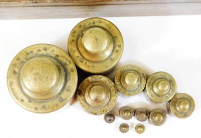 A set of Victorian brass and mahogany postal scales with weights, and a further oak block of weights. (2) - 6