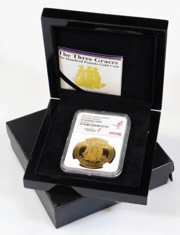 A Three Graces one hundred pound gold coin, with paperwork reading 2015 .999 gold 1oz, in outer case and box.