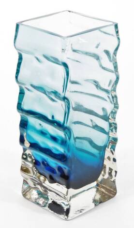 A Finnish glass vase by Henrik Koivula, with a blue tint over clear ribbed side, on square section, 20cm high.