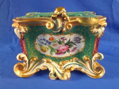 A late 19thC Paris porcelain clock base painted with panels of flowers