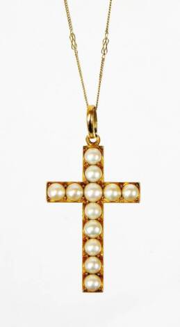 A pearl crucfix pendant and chain, the crucifix set with large cultured pearls, in unmakred yellow metal frame, on a fancy fine link chain, stamped 9ct, the crucifix 5cm x 2.5cm, 11.9g all in.