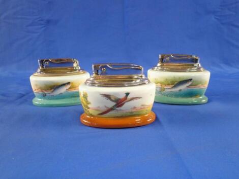 Two Minton ceramic and chrome plated lighters decorated with a leaping salmon