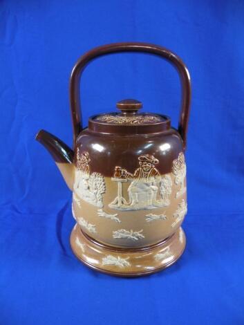 A Doulton Lambeth stoneware tea kettle and lid decorated in relief with rural scenes etc