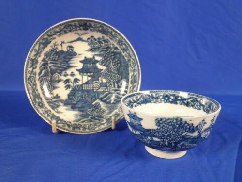 An 18thC Caughley "Fence & Garden" pattern tea bowl and saucer