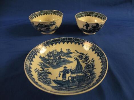 An 18thC Worcester or Caughley "Fisherman" pattern tea bowl and saucer