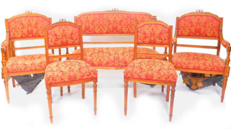 A Victorian mahogany salon suite, upholstered in red and gold foliate fabric, raised on turned legs, comprising two seater sofa, a pair of carver chairs and two single chairs, sofa 113cm W. (5)