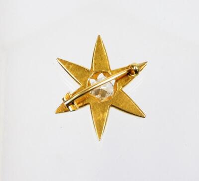 A Victorian diamond set star brooch, set with single old cushion cut diamond, in six point claw setting, 7.56mm x 7.13mm x 3.23mm, totalling approx 1.3cts overall, the diamond in a yellow metal six point star frame, yellow metal, unmarked, with single pin - 4