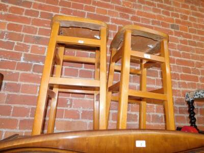 A pair of Romanian pale oak kitchen stools.