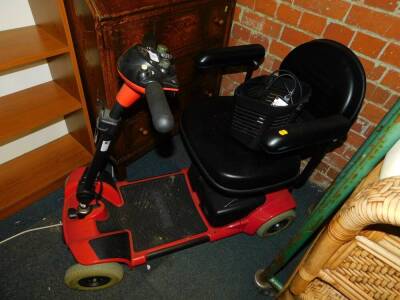 A Go Go red mobility scooter.