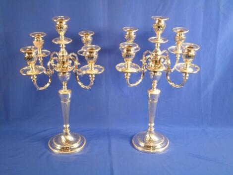 A pair of Edwardian silver plated five branch candelabra