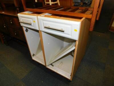 A pair of white painted kitchen units, 40cm and 30cm wide, respectively.
